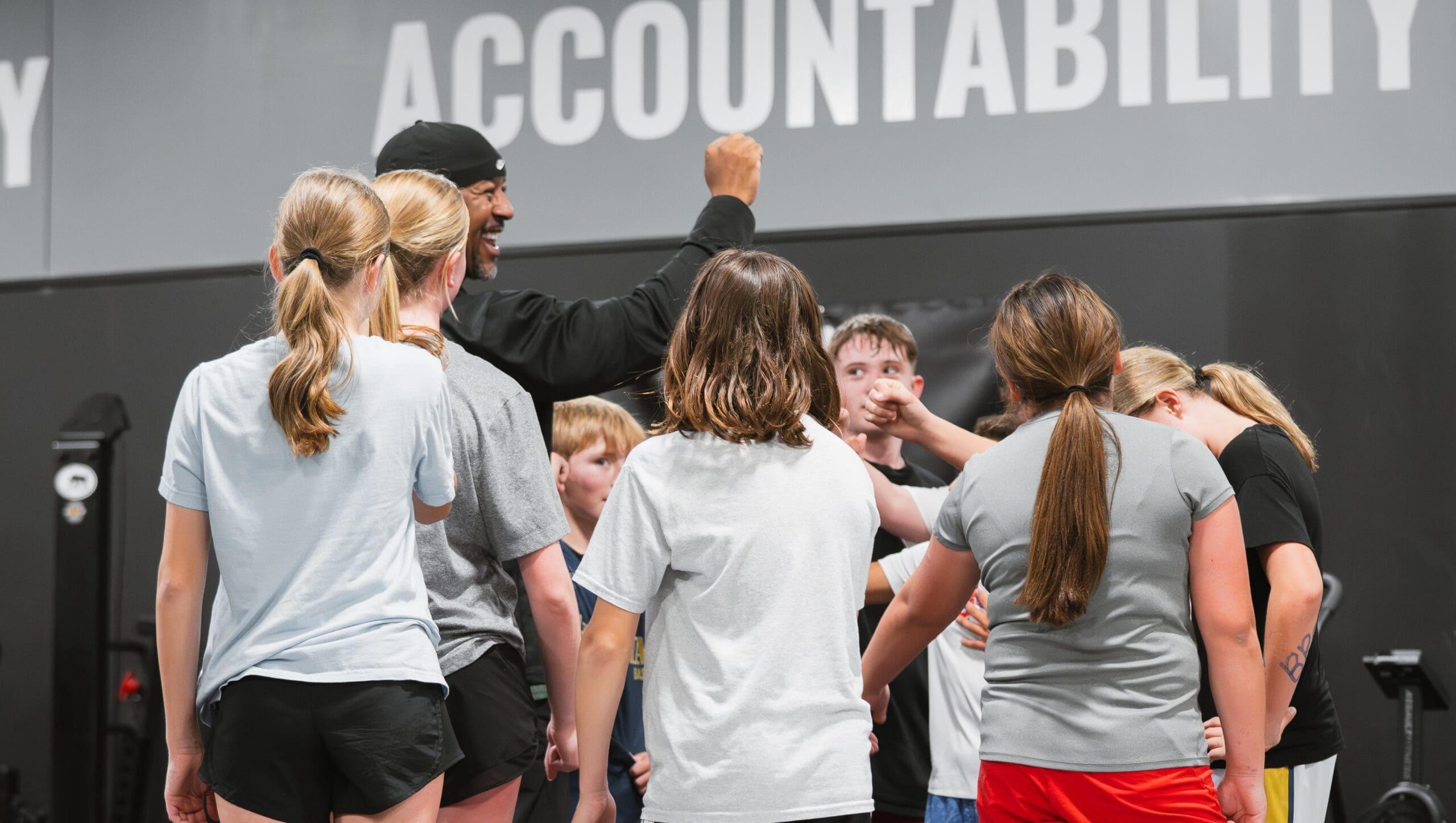 Coach and kids in a group